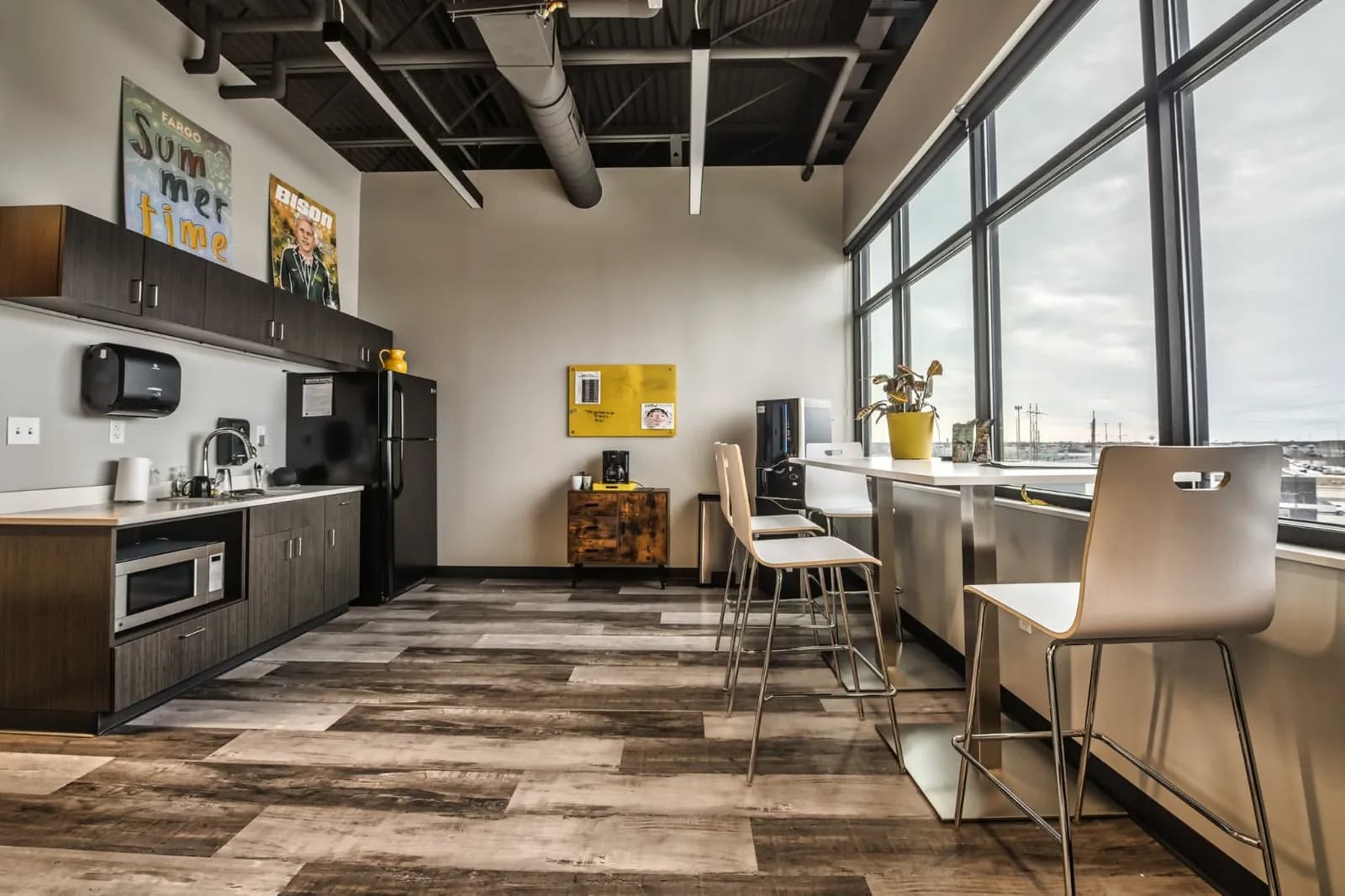 The Spotlight Media kitchen with window seating and framed magazine covers