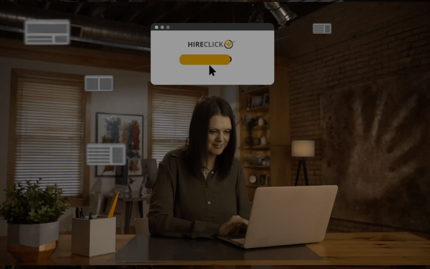 Still from a HireClick brand video: a woman at a laptop with animated job-listing graphics