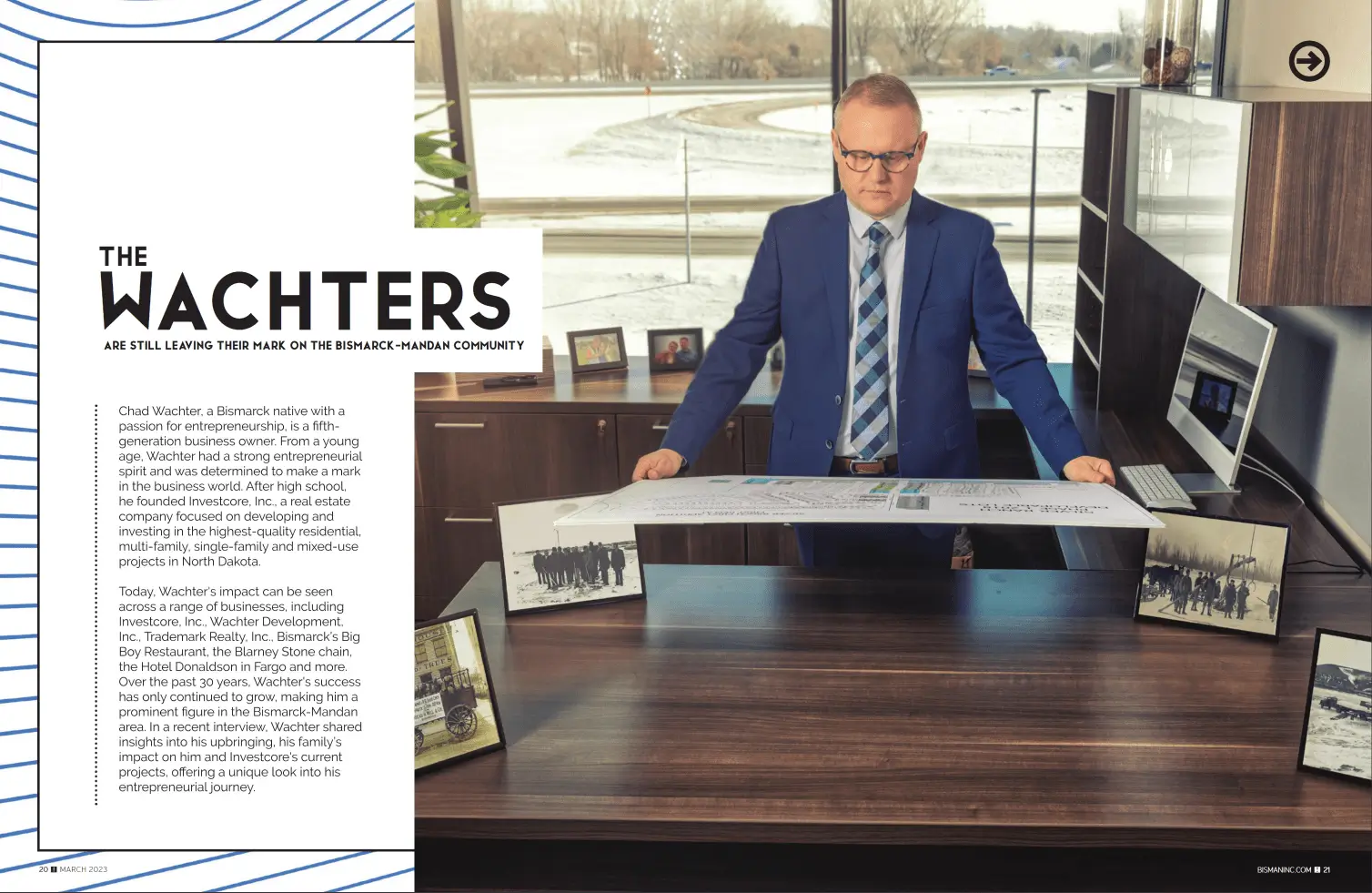 a man in a suit holding a piece of paper