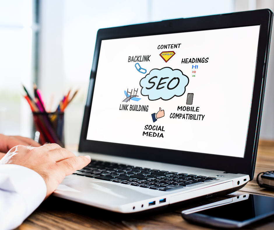 Laptop With Seo Bubble And Seo Elements Around It