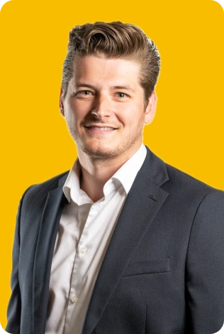 A Man In A Suit Smiling