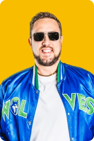 A Man Wearing Sunglasses And A Blue Jacket